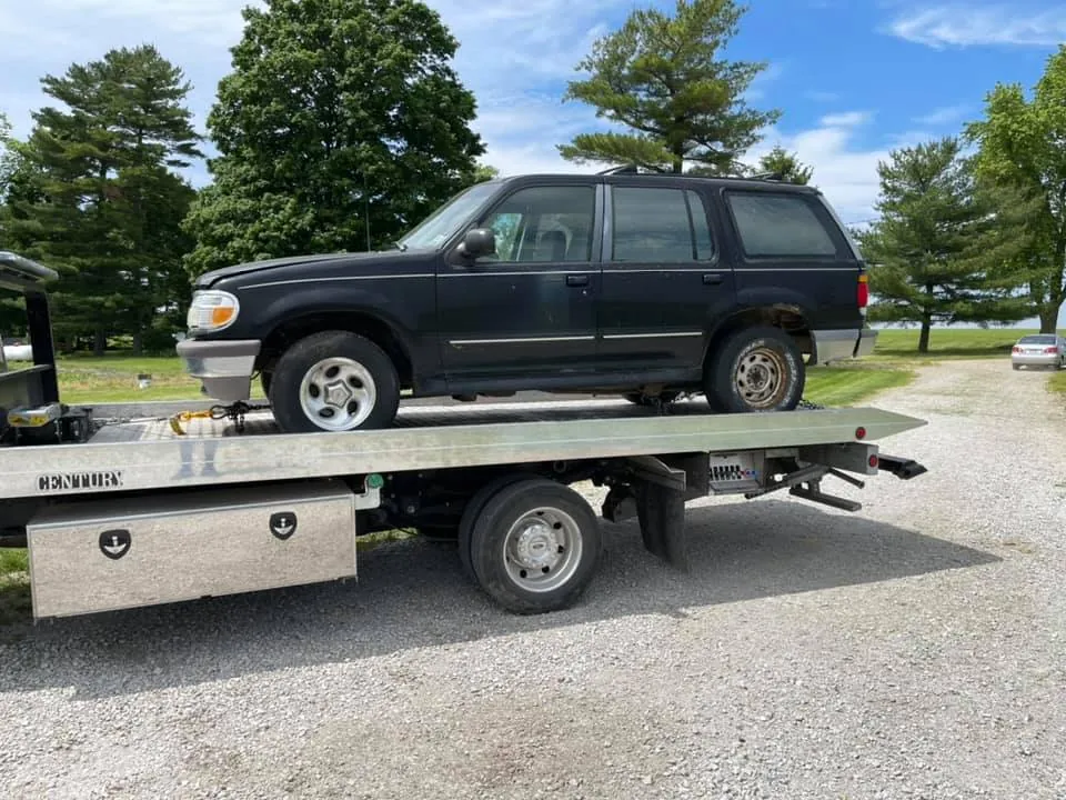 Black second-generation Ford Explorer on a tow truck in Indianapolis -- SUVs that sit high off the ground are the easiest targets for converter thieves