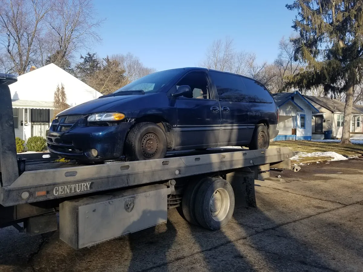 Heavily damaged sedan being evaluated for a cash offer in Indianapolis